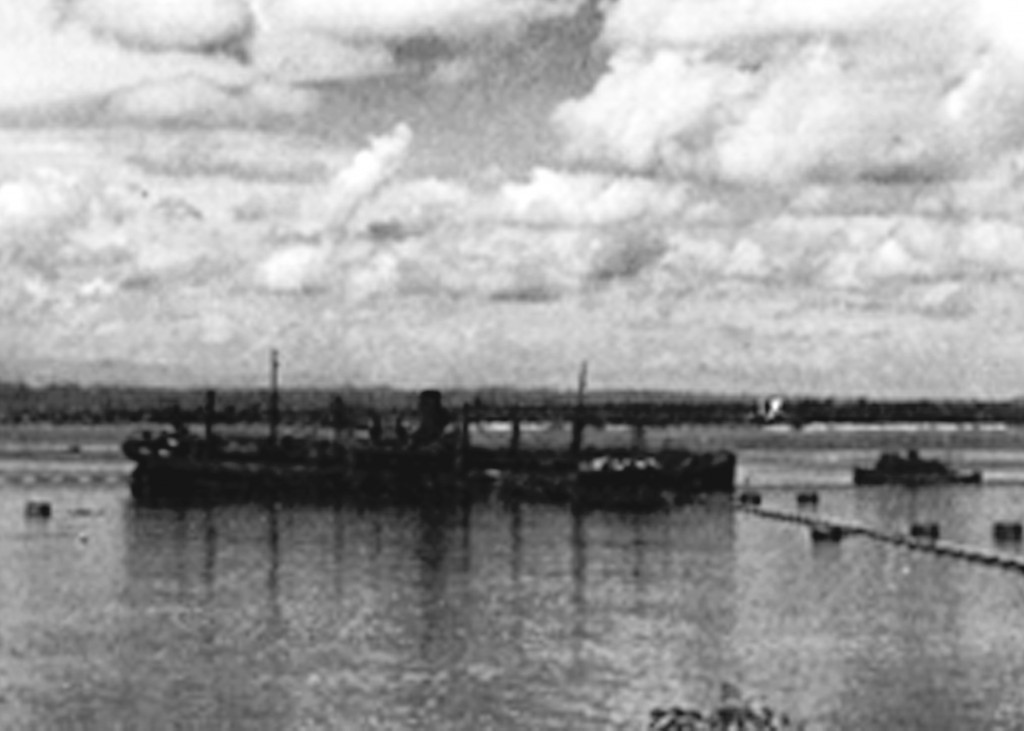 TORPEDOED MERCHANT SHIP TAKES SHELTER IN THE BAY OF SAN JUAN 1942
